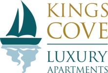 a picture of a sailboat with the words kings cove luxury apartments on a green background